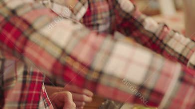 Cute boys making gingerbread icing cookies on Christmas Eve