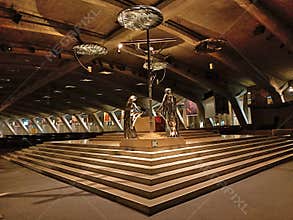 The centre nave of Underground Basilica St Saint Pius X of Sanctuary of Our Lady of Lourdes designed by the architect Pierre Vago
