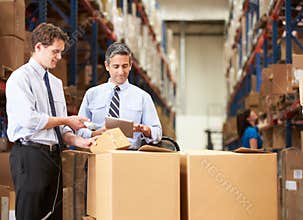 Businessmen Checking Boxes With Digital Tablet And Scanner