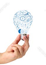 Creative light bulb in hand with drawing business strategy plan