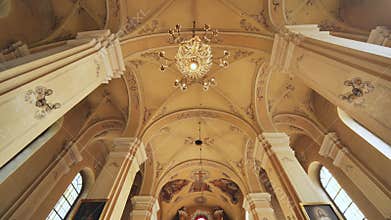 The groom is waiting for the bride in a Catholic church