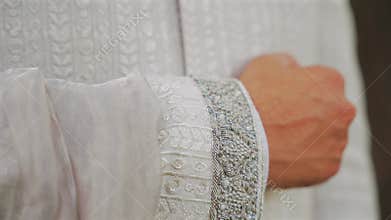 Inside the Indian wedding, the bridegroom brides together and worships the Lord. Happy indian groom handsome portrait