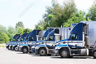 18 wheelers parked in a row.