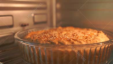 A glass pie dish is in an oven