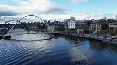 Aerial video of the River Tyne, showcasing the Millennium Bridge and Tyne Bridge in the background