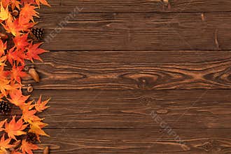 Fall Background with Orange Maple Leaves Border on Brown Wooden Table