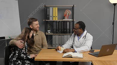 Black doctor consulting girl with father for covid, allergies or hospital
