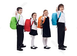 Back to school concept with happy kids giving thumbs up sign