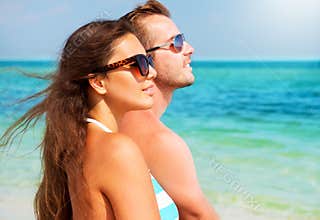 Couple in Sunglasses on the Beach
