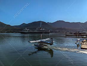 2024.08.05. Juneau, Alaska - Seaplane and a cruise ship in the port of Juneau, Alaska