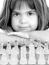 Beautiful Little Girl With Glass Chess Board