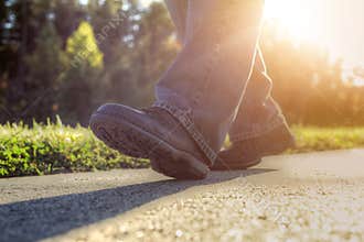 Man walking on road.