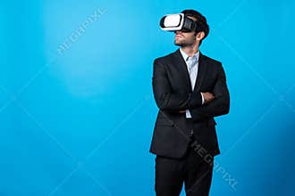 Smart business man crossing arms and standing at white background. Deviation.