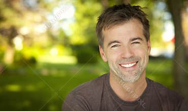 Portrait Of A Handsome Man Smiling At The Camera