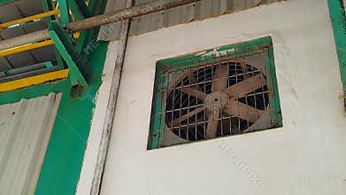 Exhaust fans are installed on the walls of buildings