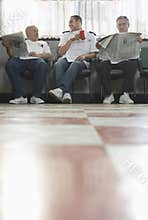 Barbers Waiting For Customers In Barbershop