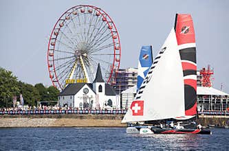 Catamarans on the bay waters with big wheel