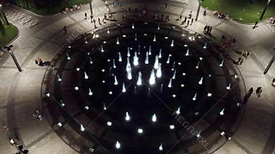 Aerial circle fountain on night Freedom Square