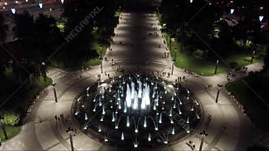 Look down aerial on fountain in night illumination