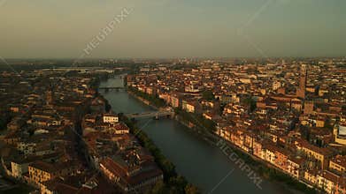 Beautiful Sunset View of Verona's Historic Architecture and the Adige River Flowing Through the City. Drone Shot.