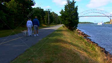 Cape Cod Canal; couple walking dog