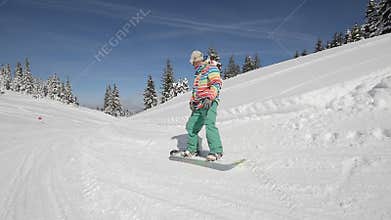 Snowboarder perform tricks