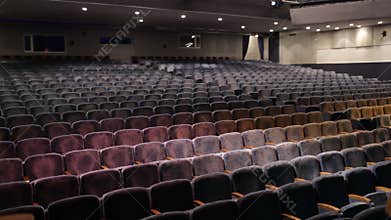 Audience fills the theatre.Time lapse.