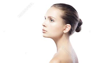Profile portrait of beautiful young woman with clean skin