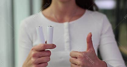 White AA batteries thumbs up