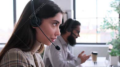 Smiling Customer Assistance Adviser Working In Office