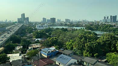 Sky train running through Bangkok Metropolis near suburb