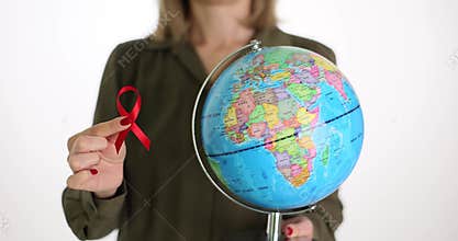 World AIDS Day HIV world globe in female hands