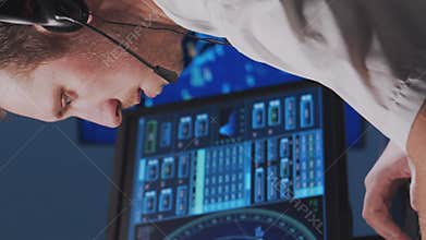 Workplace of the air traffic controllers in the control tower. Team of professional aircraft control officers works