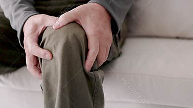 Senior man suffering from knee ache