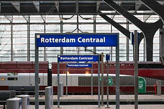 Signs Rotterdam Centraal station on platforms of train station with Eurostar arriving