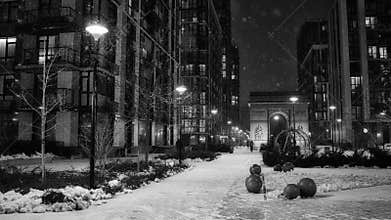 Evening snowfall in the city