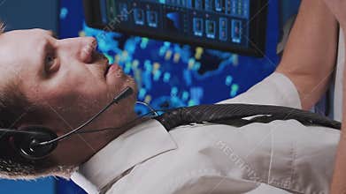 Workplace of the air traffic controllers in the control tower. Team of professional aircraft control officers works