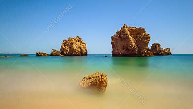 Serene Coastal Landscape: Picturesque Rock Formations in Tranquil Waters