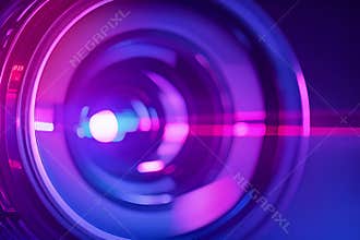 Camera lens close-up with colorful reflections