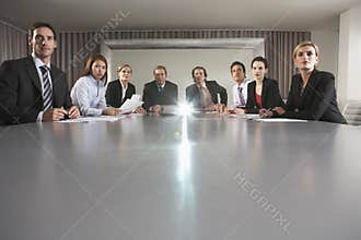 Business People Watching Presentation In Conference Room