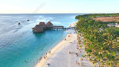 Aerial view of beautiful bungalow and sea at sunset in summer