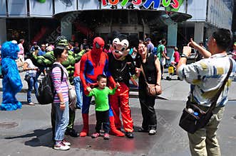 NYC: Asian Tourists Posing with Comic Book Characters