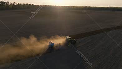 Harvest spring sunset combine field landscape Ukraine aerial green