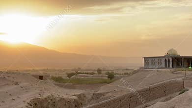 Sunset panorama with beautiful old traditional arch mosque background in Afghanistan deserted countryside