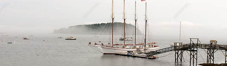 Sailboat at dock in fog