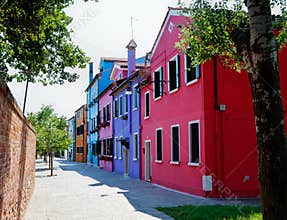 Street with colorful houses in Burano, Italy