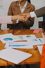 .Group of business workers smiling happy and confident. Working together with smile on face shaking hands at the office