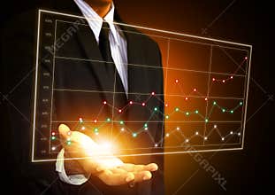 Business man hand touching a chart on screen