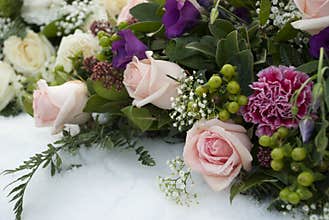Funeral flowers in the snow on a cemetery