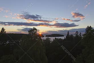 View of the sunset over the forest and Lake Ladoga from above